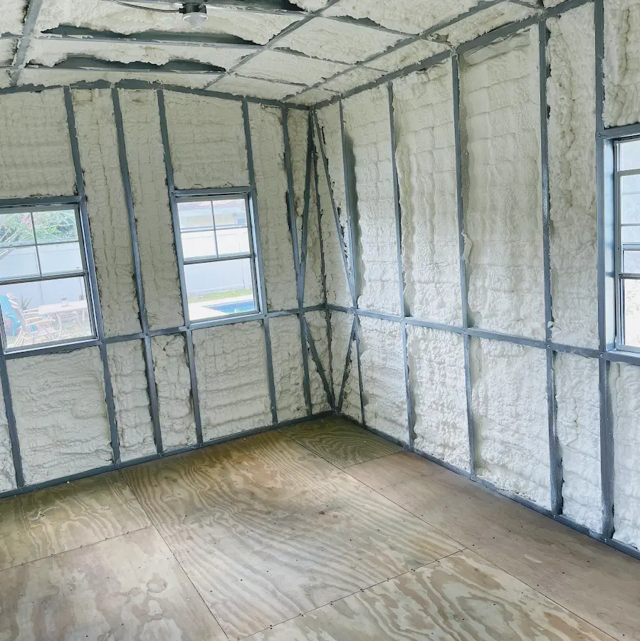 Closed-cell spray foam insulation applied to wall cavities in a residential project in Titusville